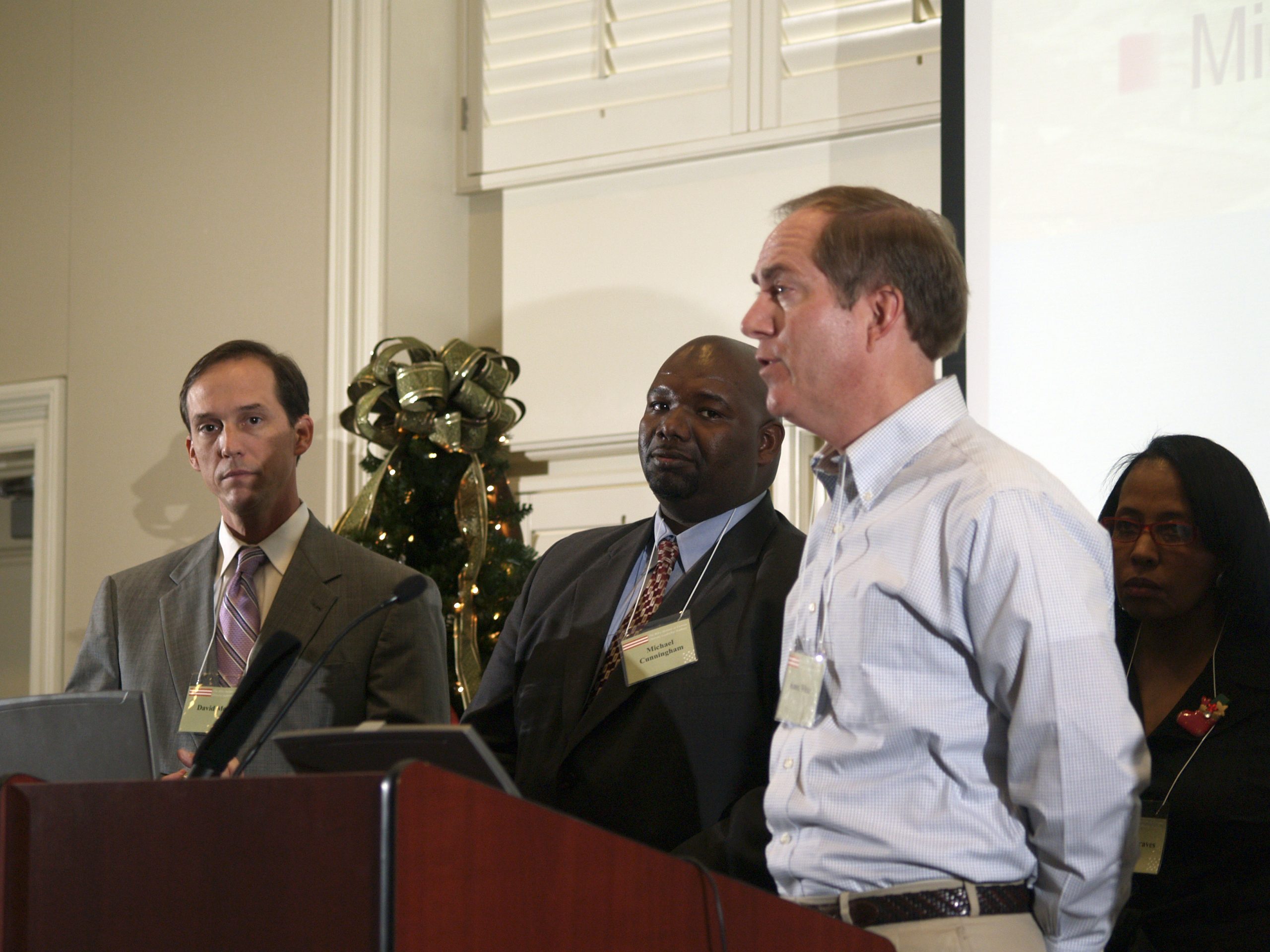 (l-r) David Moody, Michael Cunningham, Knox White presenting, and Gloria Graves