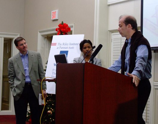 (l-r) Doug Greenwell and Timika Nesbit, and Eric Vinesse presenting