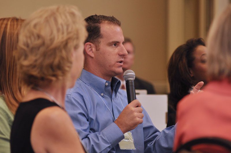 Nate Kirian posing a question to the group