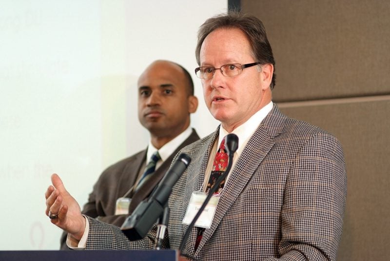 Carolina Perspectives members Phillip Florence and Tom Hund (at the podium) during their group presentation