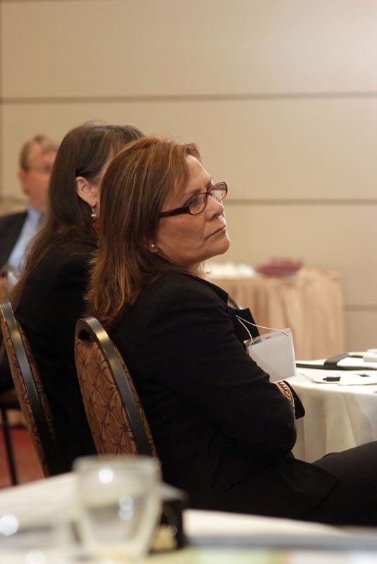 Julia Pinto, member of Bridge Builders group, listening to a group presentation