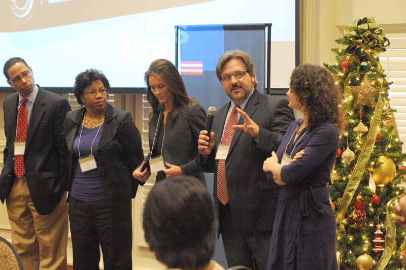 The Mobilizers: (l-r) Paul Thompson, Arelis Moore de Peralta, Lynne Fowler, Michael Posey (speaking) and Patricia Ravenhorst