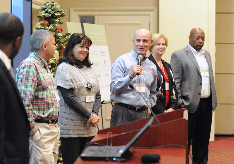 Beyond the Classroom: (l-r) James Jordon, Brian Barron, Janet Wade, Mike Padilla (speaking), Becky Faulkner and Chis Smith