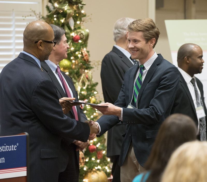 Joshua Friesen, accepting his certificate, is now a Riley Fellow