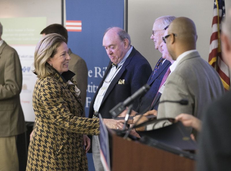 Elizabeth Colbert-Busch, accepting her certificate, is now a Riley Fellow