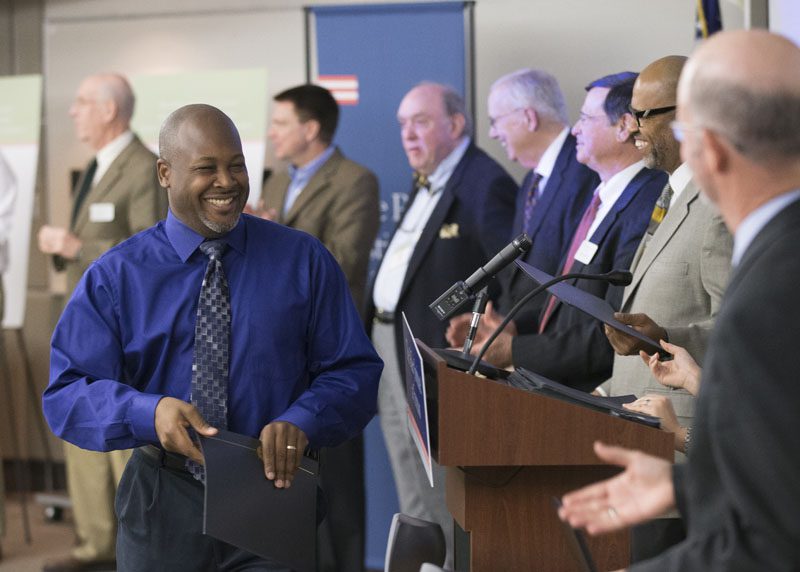 Stephen Grant, accepting his certificate, is now a Riley Fellow