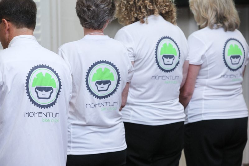 Members of The Bike Hubbers sport t-shirts supporting Momentum Bike Clubs, their project partner.