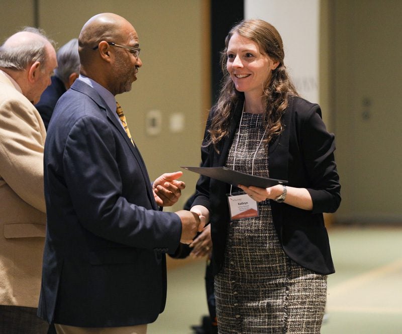Kathryn Diminich, Wake Up Carolina, receiving her Riley Fellow certificate from Juan Johnson