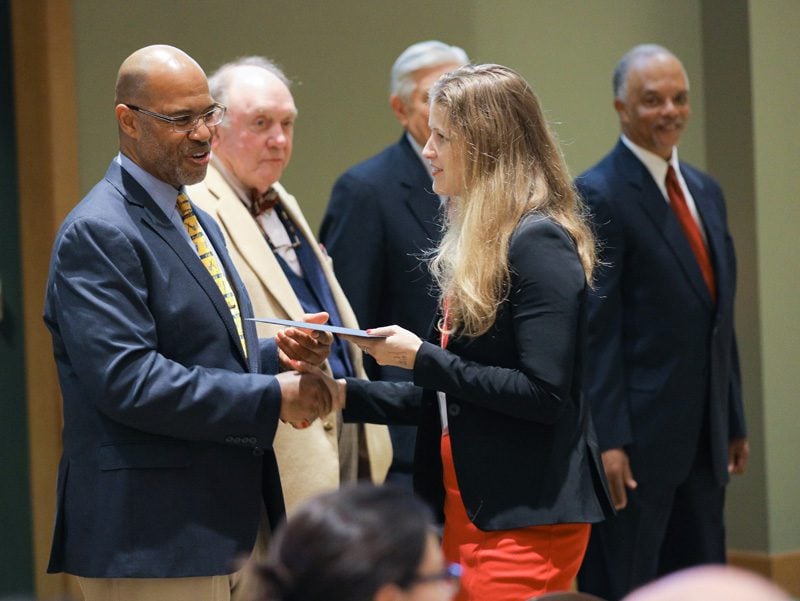 Sally Newman, Team Leverage, receiving her Riley Fellow certificate from Juan Johnson