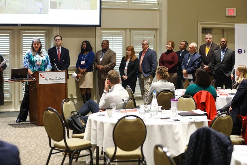 PW Chop: (l-r) Amy Mundt speaking, Matt Bitner, Altheia Richardson, Rich Hagins, Carol Samofal, Walt Gregory, Kirsten Small, Jim Dant, Lee Tennent, Burke Royster, Marcus Davenport