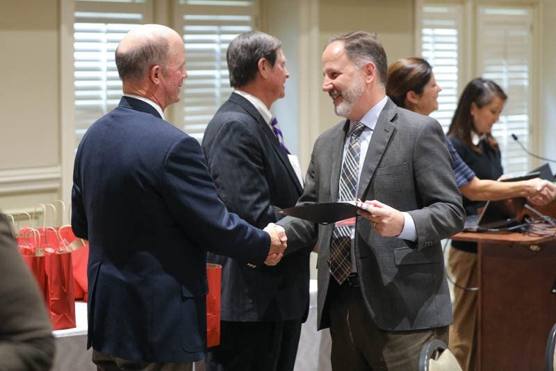 Tom Evelyn, PW Chop, receiving his Riley Fellow certificate