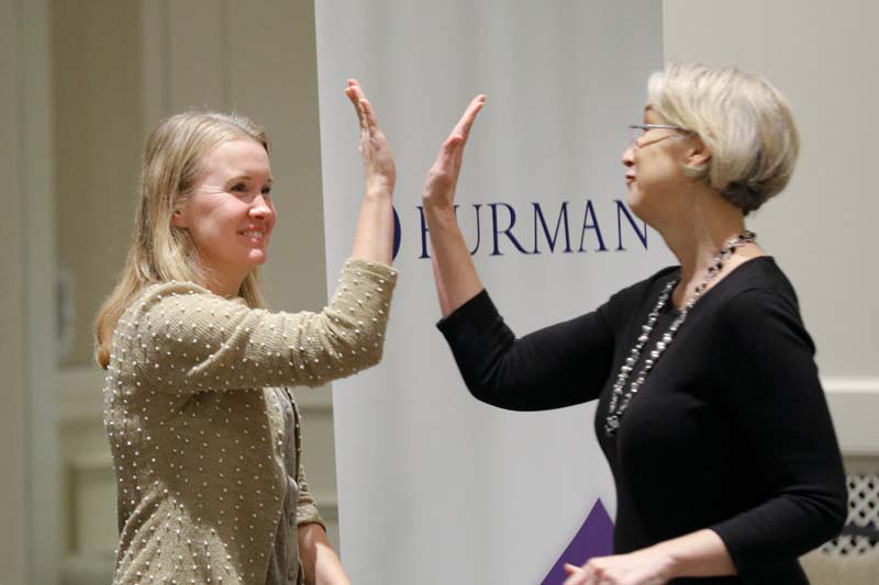Melanie Armstrong and Stacey Bechtold, Swamp Rabbit Express, share a high five