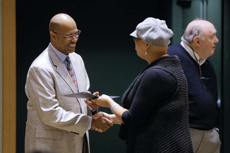 Adrienne Troy-Frazier, Safe Water Initiative at Metanoia (SWIM), receiving her Riley Fellow certificate from Juan Johnson