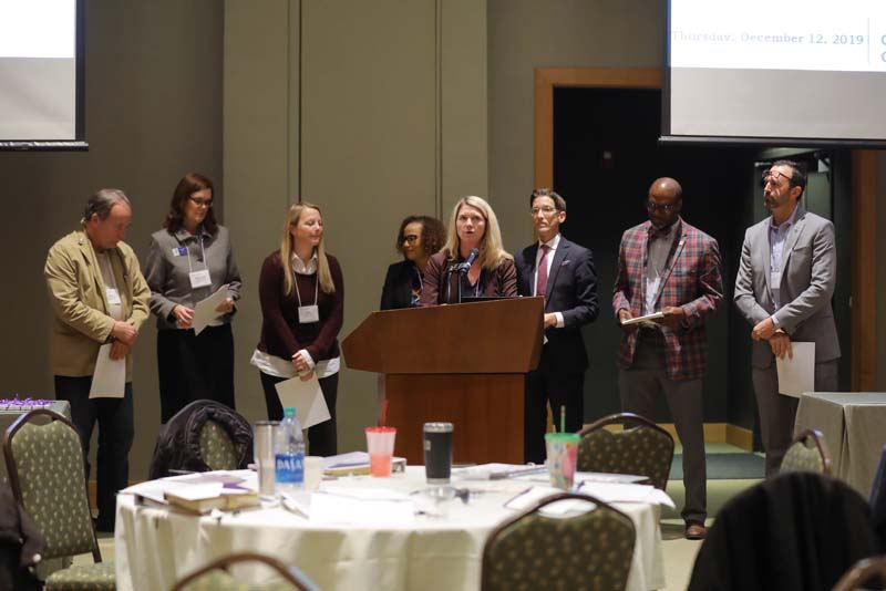 (l-r) Rick Baumann, Stephanie Kelley, Amy Prock, Patrice Davis, Ashley Redmond speaking, Jeremy Rutledge, Melvin Williams and Scott Sharp, Carried Away
