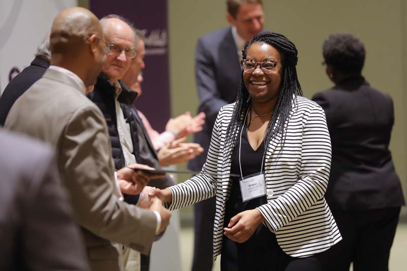 Amber Johnson, Group Two, receiving her Riley Fellow certificate from Juan Johnson