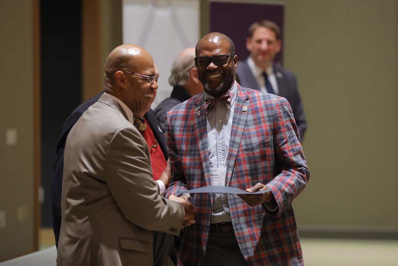 Melvin Williams, Carried Away, receiving his Riley Fellow certificate from Juan Johnson