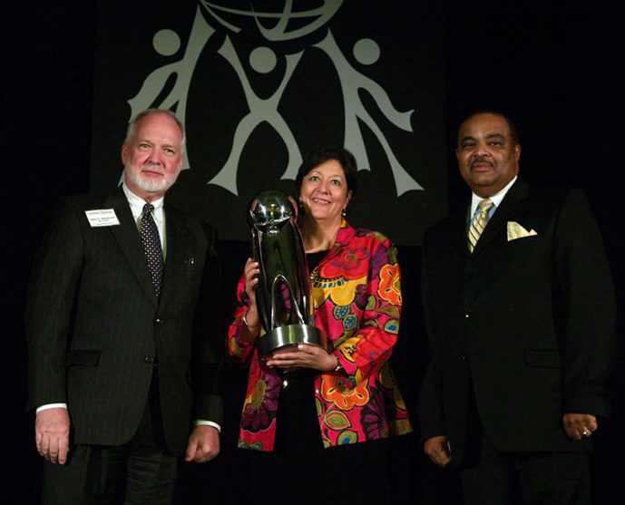 Bon Secours St. Francis Health System was the recipient of the Outstanding Business Award. (l-r) Dr. John Stockwell and Liz Keith from Bon Secours St. Francis, and Reginald Avery.