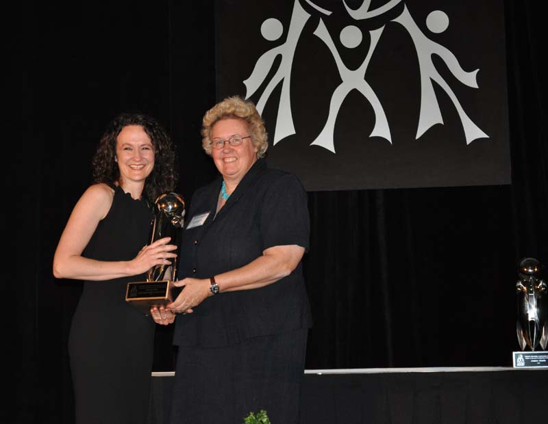 Patricia Ravenhorst (left), Director of the South Carolina Immigrant Victims Network, was the recipient of the Outstanding Contribution to International Diversity award. Sue Schneider of Spartanburg Water (right) presented the award to her.