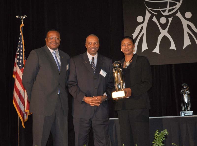 The Call Me MISTER program received the Outstanding Nonprofit Organization award. Dr. Roy Jones (center) accepted the award; Sandra Hayes (right), BMW, presented the award.