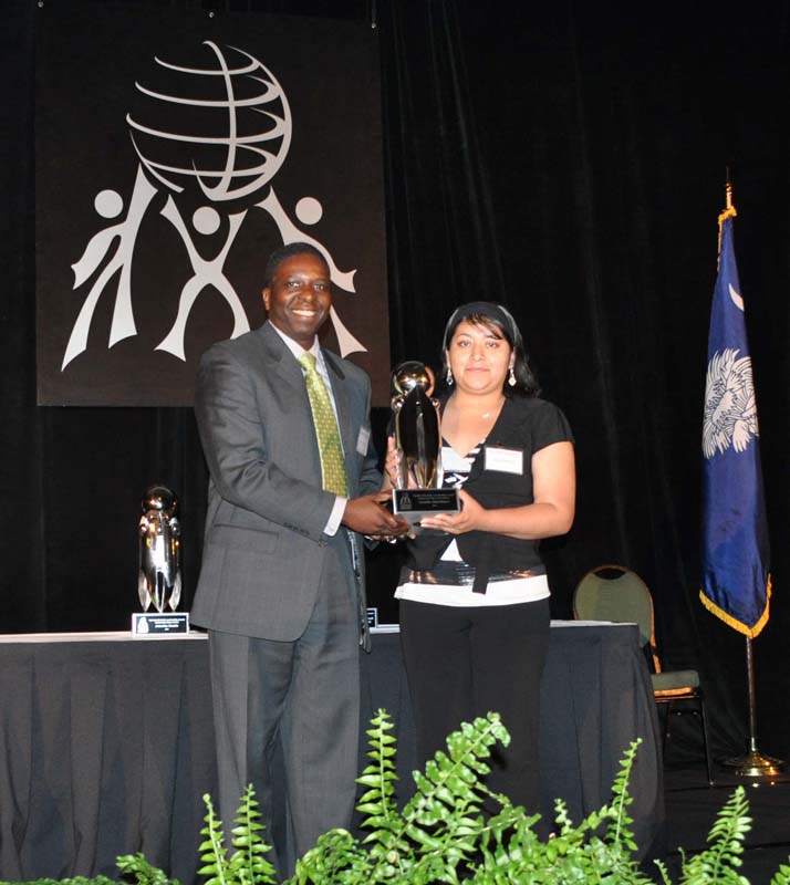 Azalia Martinez, a senior at Berea High School, was the recipient of the Outstanding High School Student award. Mr. Ken Peeterson, Vice President of Human Resources and Diversity with BI-LO, LLC, presented the award to her.
