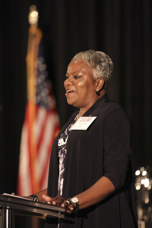 Juana Slade, DLI Upstate Class II graduate and Director of Diversity and Language Services at AnMed Health, singing the National Anthem