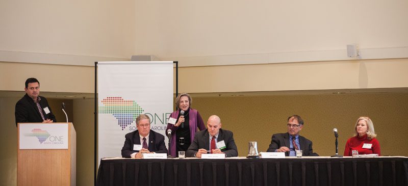 (l-r) Mark Quinn, Harvey Galloway, Renée Romberger, FACHE, VP for Community Health Policy and Strategy, Spartanburg Regional Healthcare System speaking, Ron Jones, Joe Kyle and Lynn Hammond
