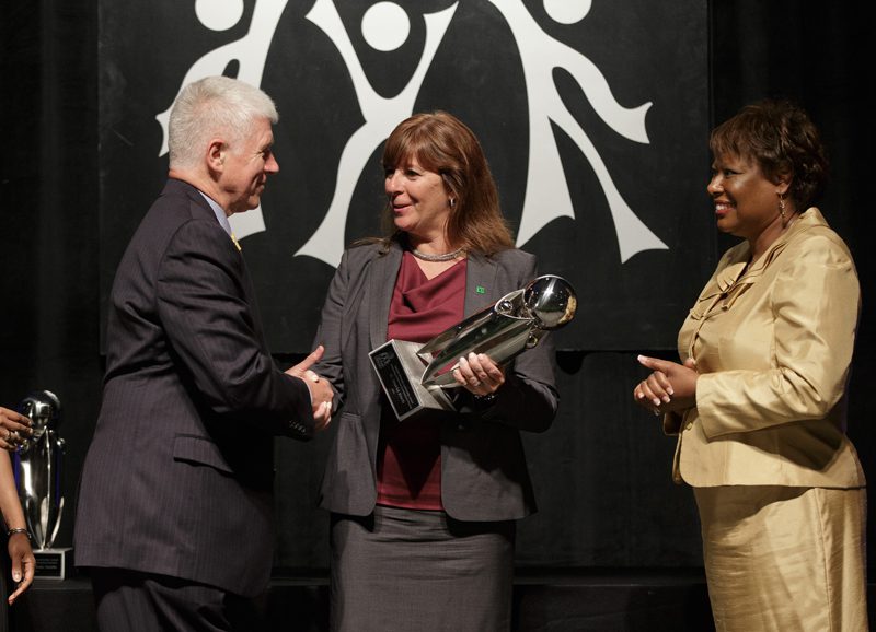 Linda McGuigan, TD Bank Senior Vice President of Retail for North Carolina and South Carolina, presenting the Outstanding Contribution to International Diversity to David Esch, Steering Committee member, Upstate International; the award was sponsored by TD Bank
