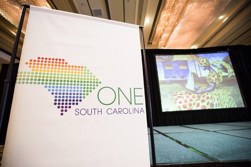 Images of Jonathan Greene's paintings, which capture Southern culture and traditions, were used as a backdrop on the stage
