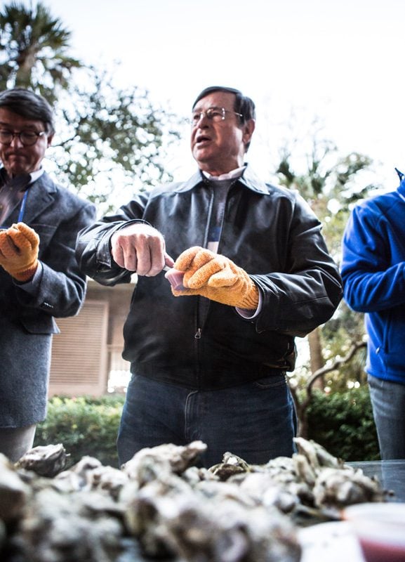 Don Gordon busy shucking oysters