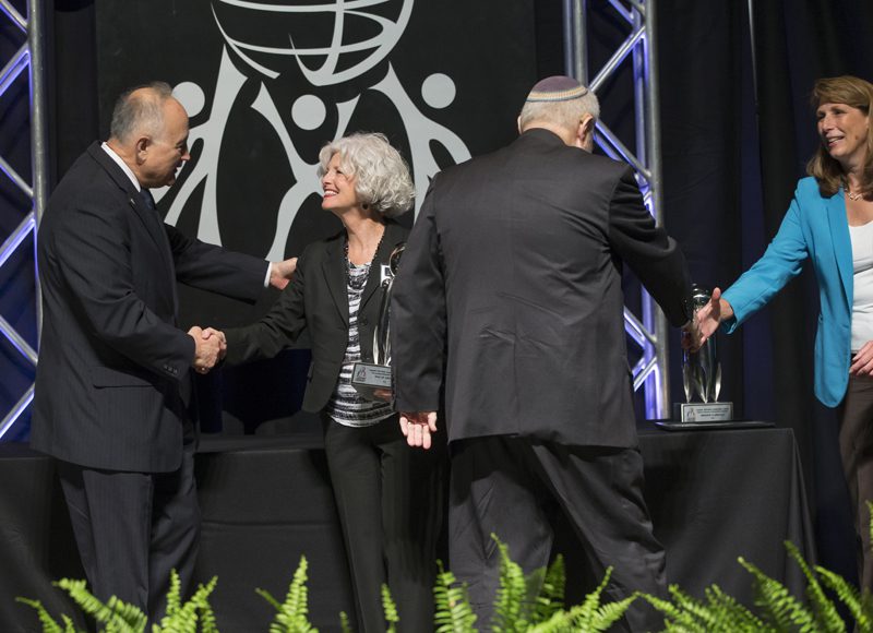 The Outstanding Nonprofit Award recipient is the Year of Altruism. Accepting the award are the co-founders of the Year of Altruism, Marc Wilson and Robert St. Claire.