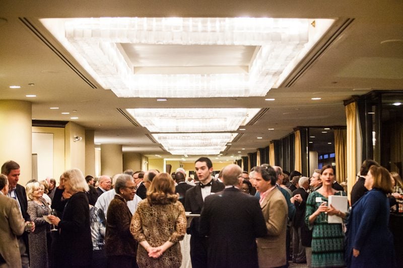 DLI alumni enjoying the camaraderie and catching up with friends at the reception