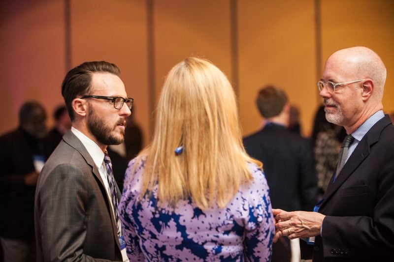 Ken May, far right, catching up with DLI alumni