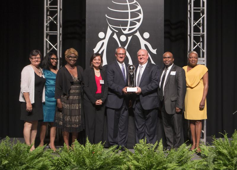 The Outstanding Nonprofit Award recipient is the United Way of Greenville County. Max Metcalf presenting the award to Ted Hendry, Rabbi Jeremy Master, Pastor Sean Dogan, Adela Mendoza, Cynthia Chance and Yvonne Reeder.