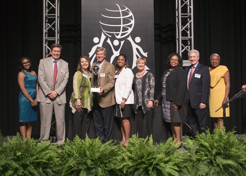 The recipient of the Outstanding Business Award was Denny's Corporation. John Miller, Jill Van Pelt, Wally Harris, Deanna Banister, Scott Melton, April Kelly-Drummond and Michelle Hunt accepting the award.