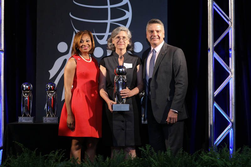 (c) Jennie Neighbors, English teacher at St. Joseph's Catholic School, accepting the William T. Wylie VALUED Lives Award for School Excellence