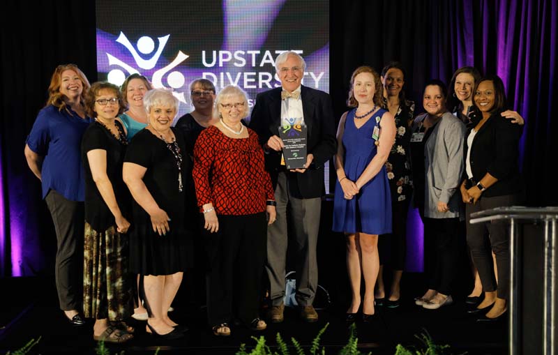 Bob Saul (c) with representatives from GHS Children's Hospital