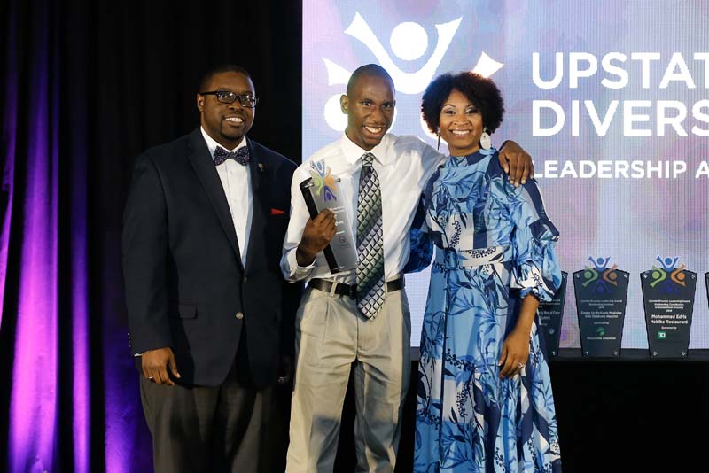 The Outstanding High School Student Award was awarded to Hugh Hill (c); award was sponsored by Greenville Technical College.