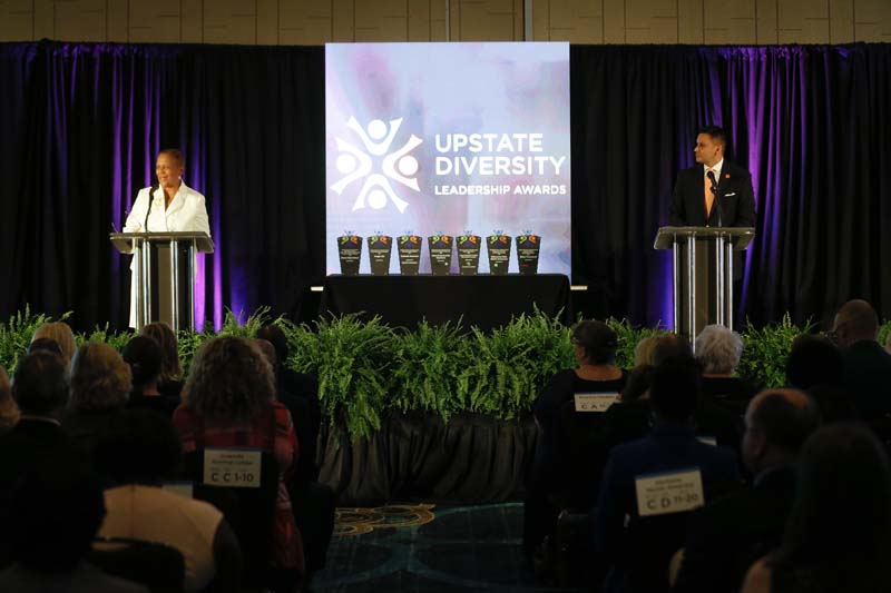 Roz Weston, owner of RAWeston Communications, and Julio Hernandez, Chief of Staff for the Division of Inclusion and Equity at Clemson University, welcoming guests to the annual awards ceremony