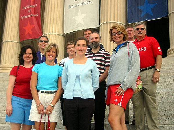 (l-r) Christa Stevens, Mark Shelley, Downing Hudson, Bonny Duncan, Liz Smith, Chris Burkett, Brian Myers, Dodie Ballard, Jerry Willard and Robert Hutchins in front of the National Archive Building