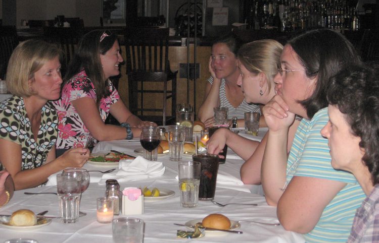 Dr. Liz Smith and the teachers relaxing and enjoying each others company after a long day