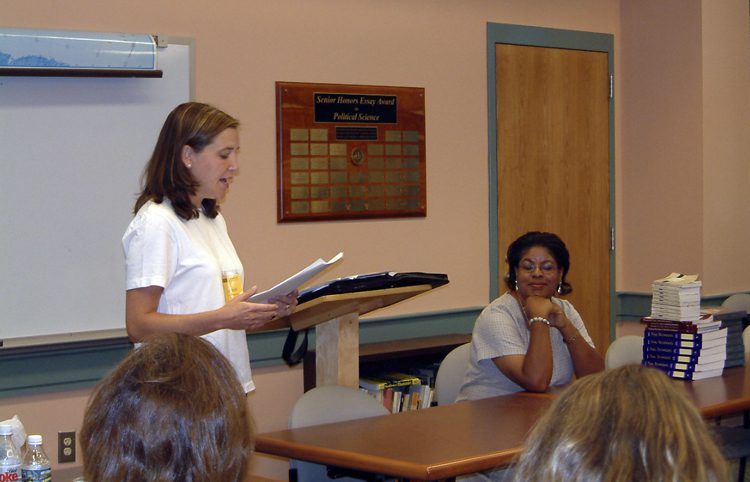Dr. Liz Smith introducing speaker, Teresa Cosby, lawyer & Furman Mock Trial coach