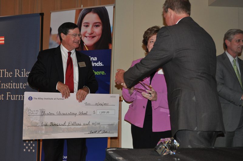 Don Gordon presenting $1,000 award to Clinton Elementary School, Lancaster: American Reading Company's 100 Book Challenge