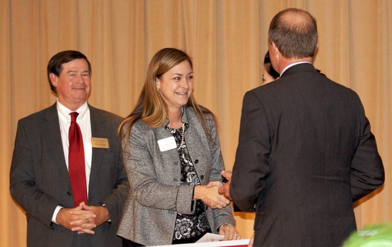 C.C. Bates, Director, Reading Recovery Training Center, Clemson University, receiving their award from Beth Wingard
