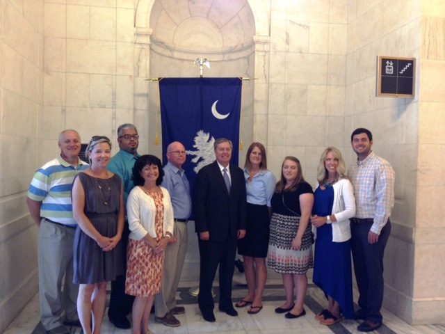 (l-r) Bob Roudybush, Liz Smith, Pablo Rivera-Arriaga, Katie Crosby, Glenn Robinson, Senator Lindsey Graham, Taylor Bauer, Aubry Stegall, Melody Shafer and Daniel Bailey
