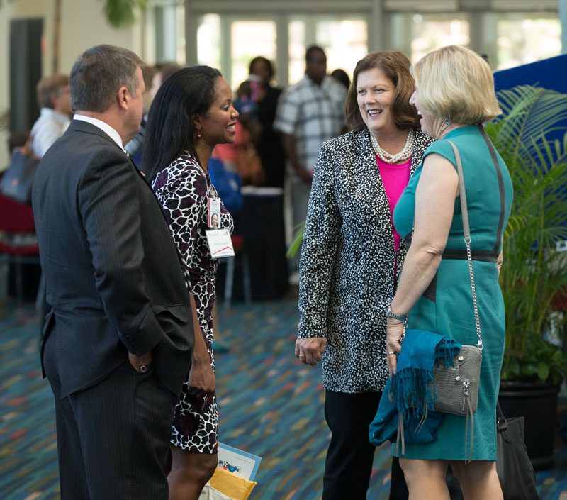 Molly Spearman speaking with guests