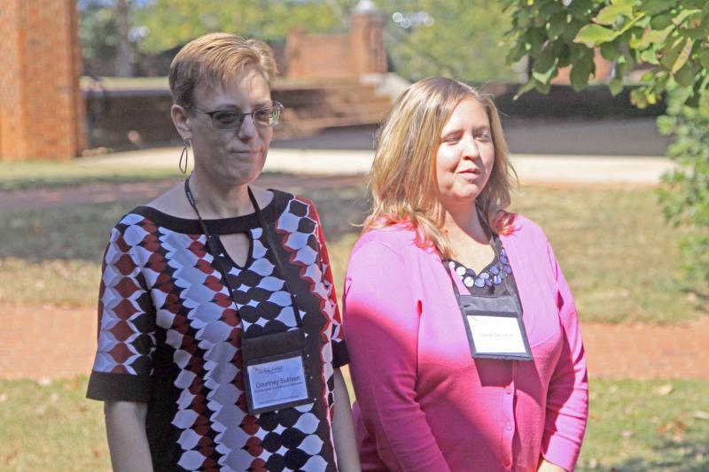 Fellows Courtney Sullivan & Laura Saccente participating in a demonstration of summer learning loss between an affluent child and a child in poverty