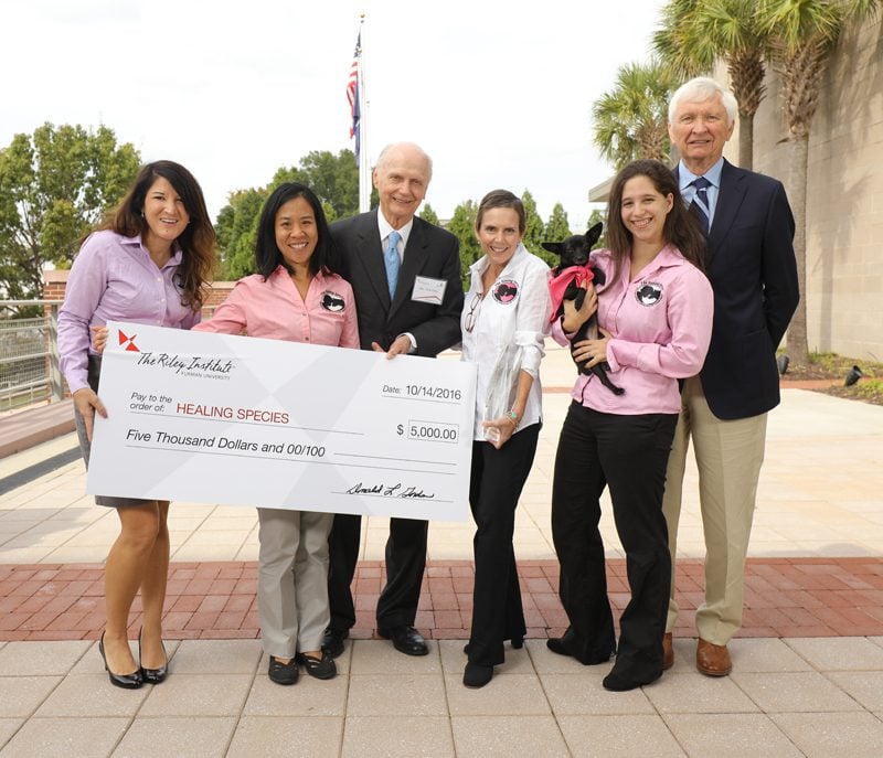 Healing Species (l-r): Amanda Cisco, Kate Wong, Secretary Riley, Cheri Brown Thompson, Lucia Marotta-Schenk with Tiny, and Charles Thompson