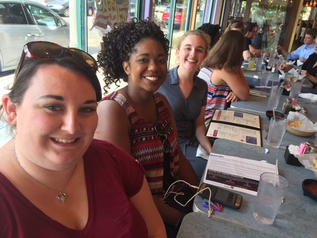 Sabrina Cheek and Crystal Whitaker with Gray Johnson, a Furman graduate, working in DC