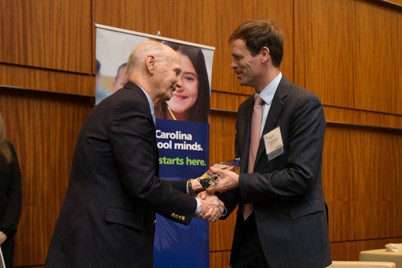 Secretary Riley congratulating Ansel Sanders, President and CEO, Public Education Partners