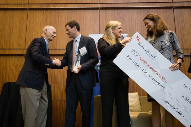 Caroline Mauldin presenting the winning award to Lee Yarborough, Make Summer Count program